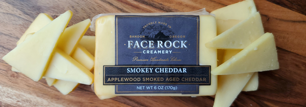a smokey cheddar package surrounded by cut slices of smokey cheddar